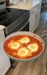 Shakshuka right out of the oven - fresh set eggs on top of a delicious, spiced tomato sauce