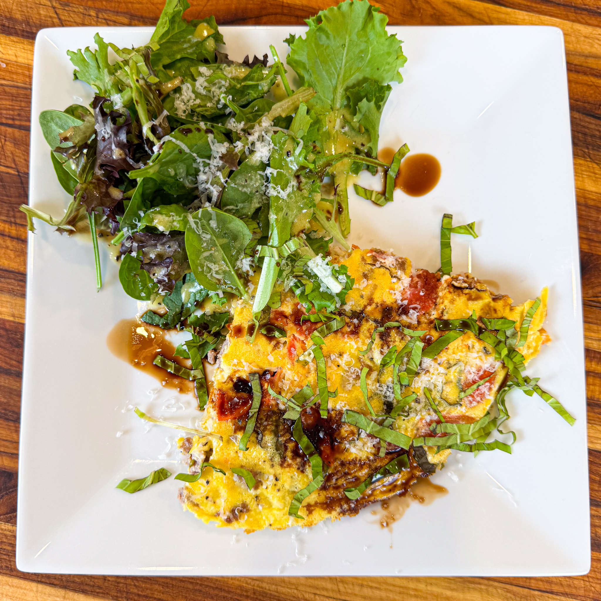 delicious, high-protein dish that combines the flavors of Italian sausage, fresh basil, and juicy grape tomatoes, all baked into a fluffy, savory frittata. Served with a side salad and light homemade dressing