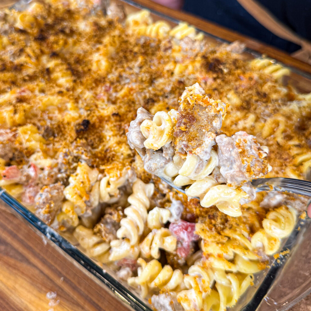 Station 15’s Four Cheese Pasta combines ground turkey, a creamy blend of cottage cheese, cream cheese, and nutritional yeast, with fusilli pasta, spicy pork rinds, and a touch of fennel and paprika, baked to a golden, bubbly perfection.